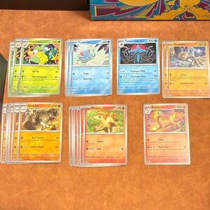 Pokémon 151 Trading Cards - Assorted Fire, Water, Grass, and Rock Types